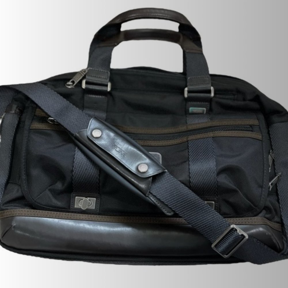 Tumi - laptop briefcase - black/brown leather. Fits 16" laptop. Good pre-owned